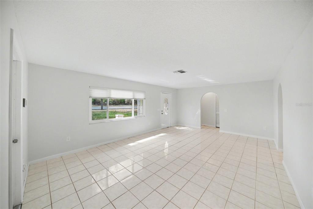 113 Ruskin Avenue Spring Hill, FL 34606 - Photo 6 of 32 a view of an empty room with window