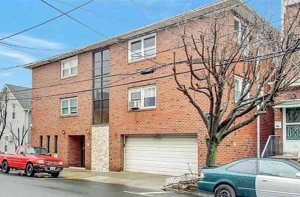 a view of a car parked in front of a house