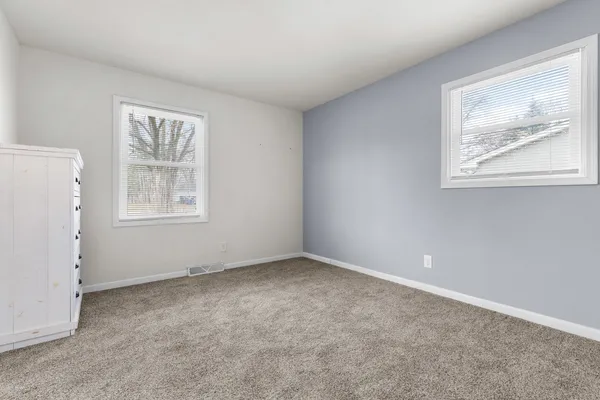 an empty room with windows