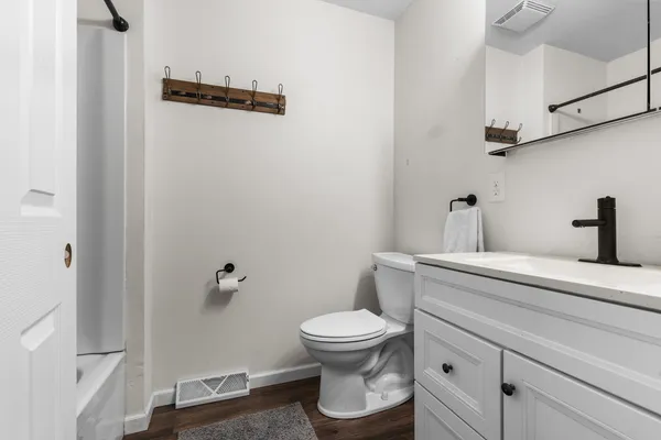 a bathroom with a toilet and a sink
