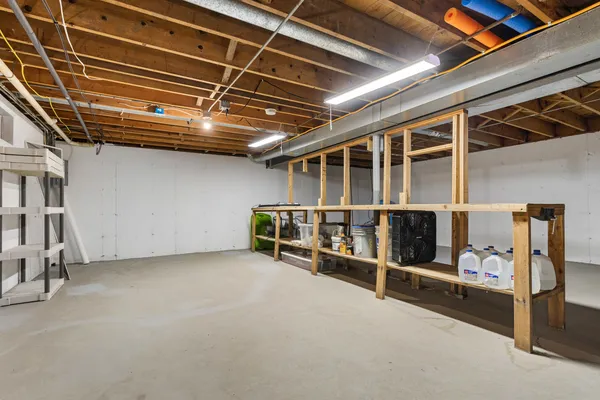 a view of an empty room with wooden roof