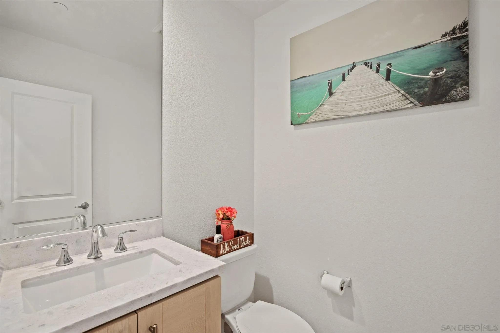 1150 Via Lucero Oceanside, CA 92056 - Photo 14 of 36 a bathroom with a sink vanity and toilet