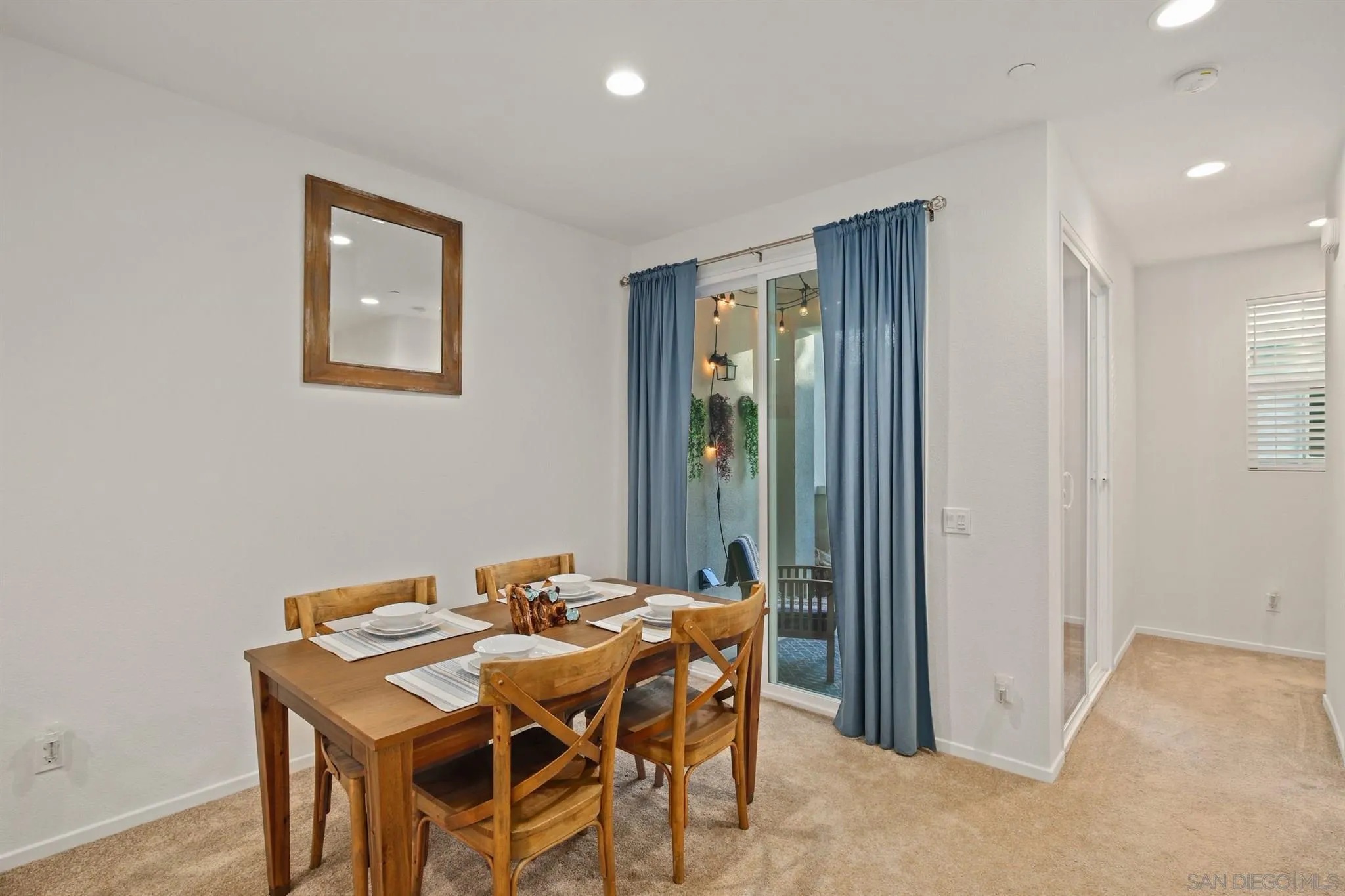 1150 Via Lucero Oceanside, CA 92056 - Photo 17 of 36 a dining room with a table and chairs