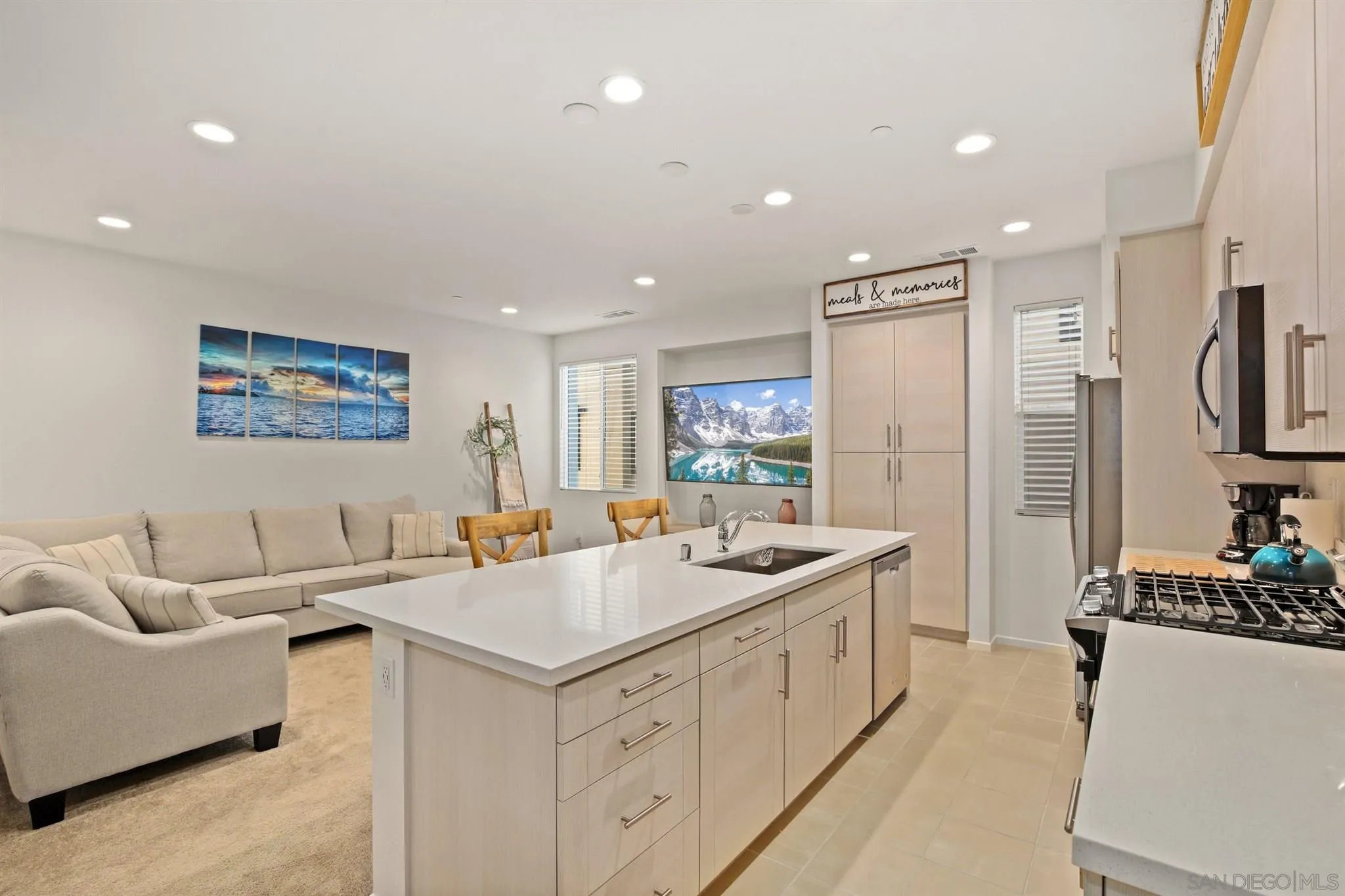 1150 Via Lucero Oceanside, CA 92056 - Photo 19 of 36 a kitchen with white cabinets and sink