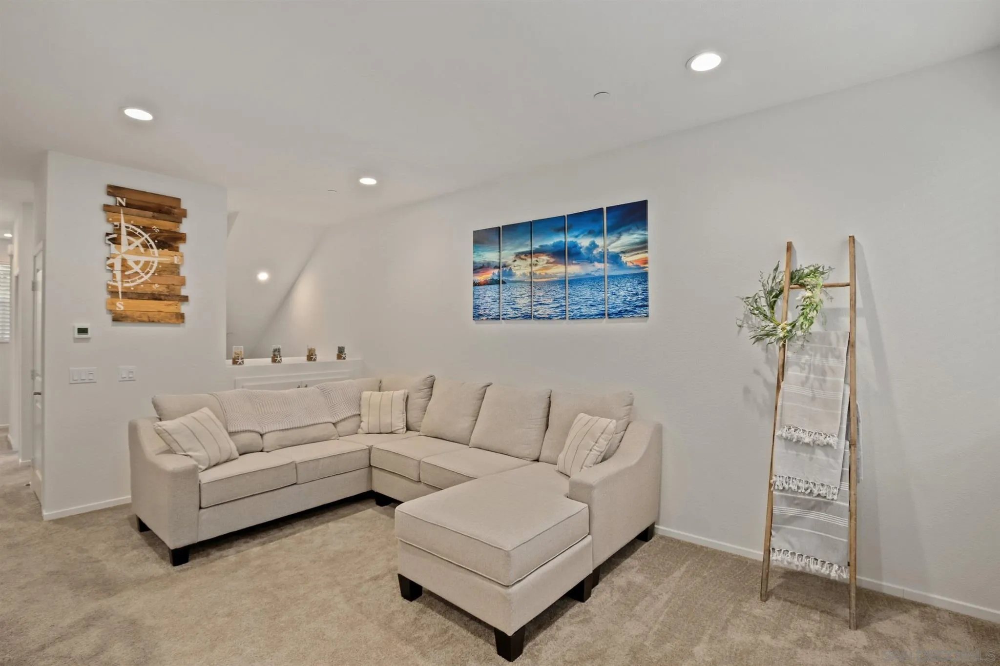 1150 Via Lucero Oceanside, CA 92056 - Photo 22 of 36 a living room with furniture and a painting on the wall
