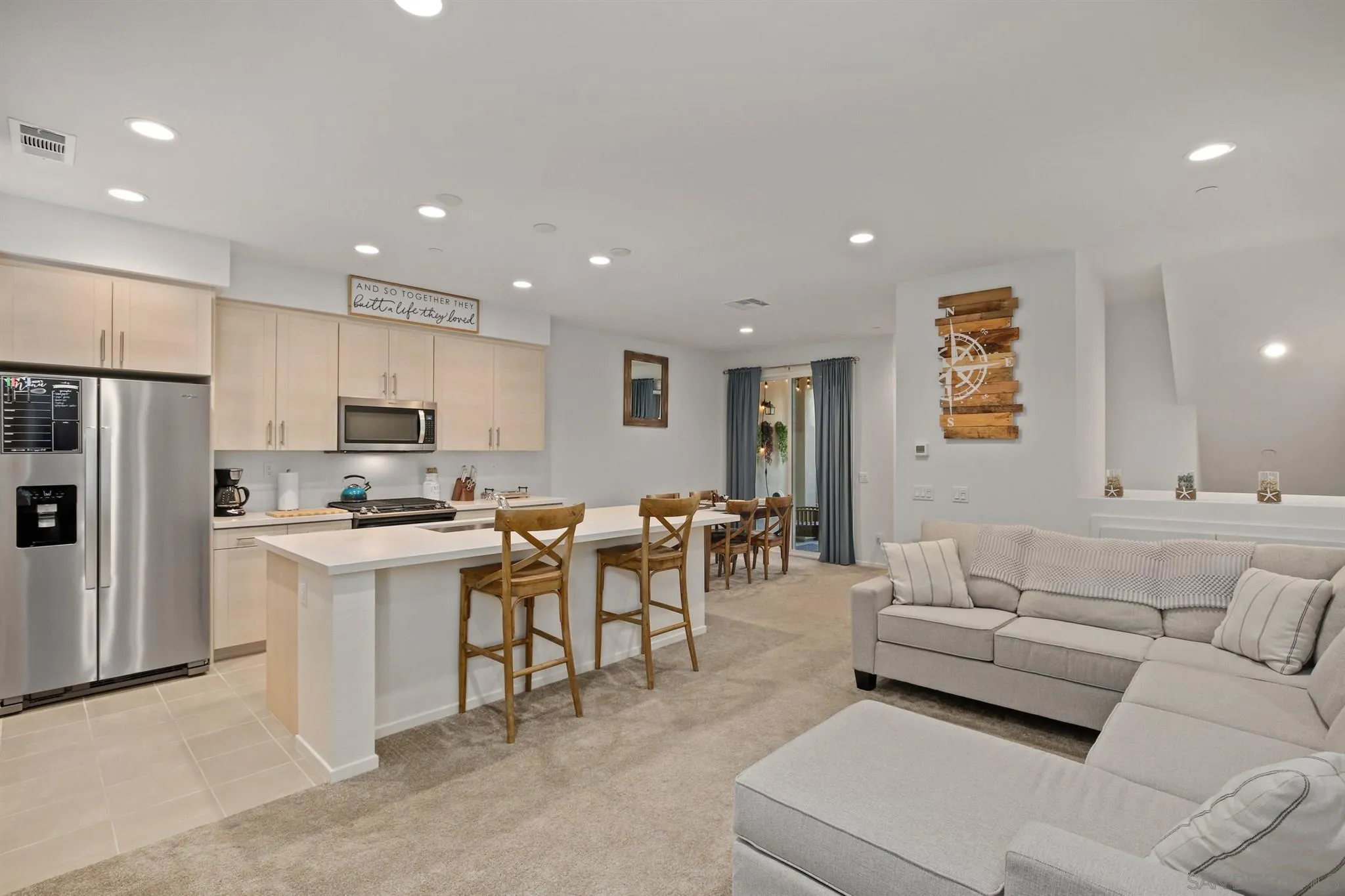 1150 Via Lucero Oceanside, CA 92056 - Photo 23 of 36 a living room with lots of furniture and kitchen view