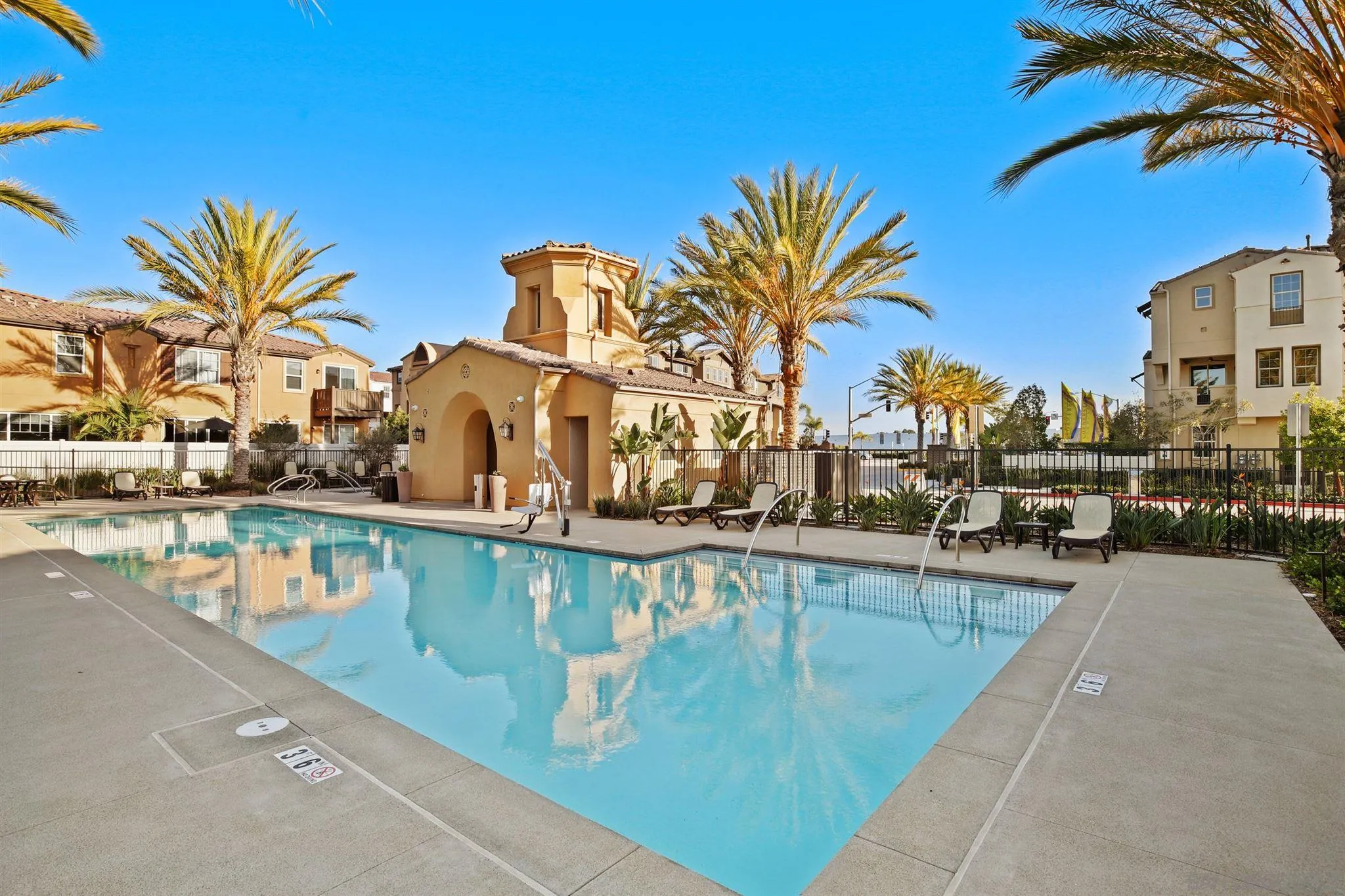 1150 Via Lucero Oceanside, CA 92056 - Photo 33 of 36 a view of a swimming pool with a lawn chairs