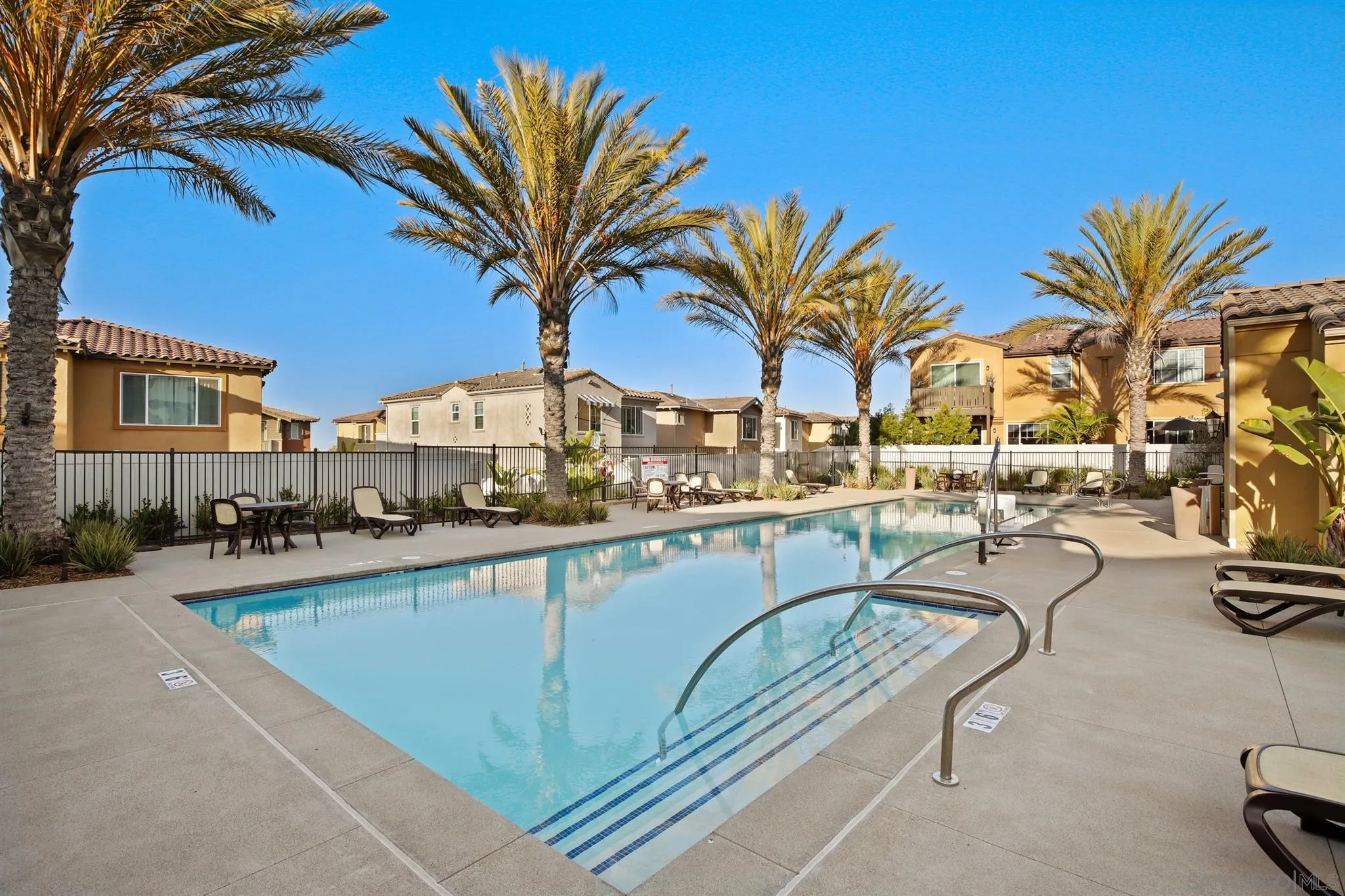1150 Via Lucero Oceanside, CA 92056 - Photo 34 of 36 a view of a swimming pool with chairs