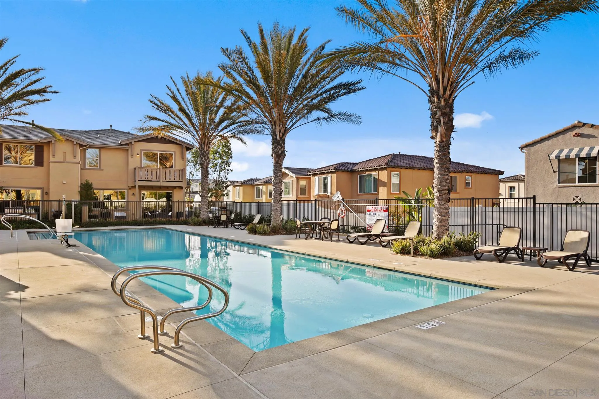 1150 Via Lucero Oceanside, CA 92056 - Photo 35 of 36 a swimming pool with outdoor seating and yard