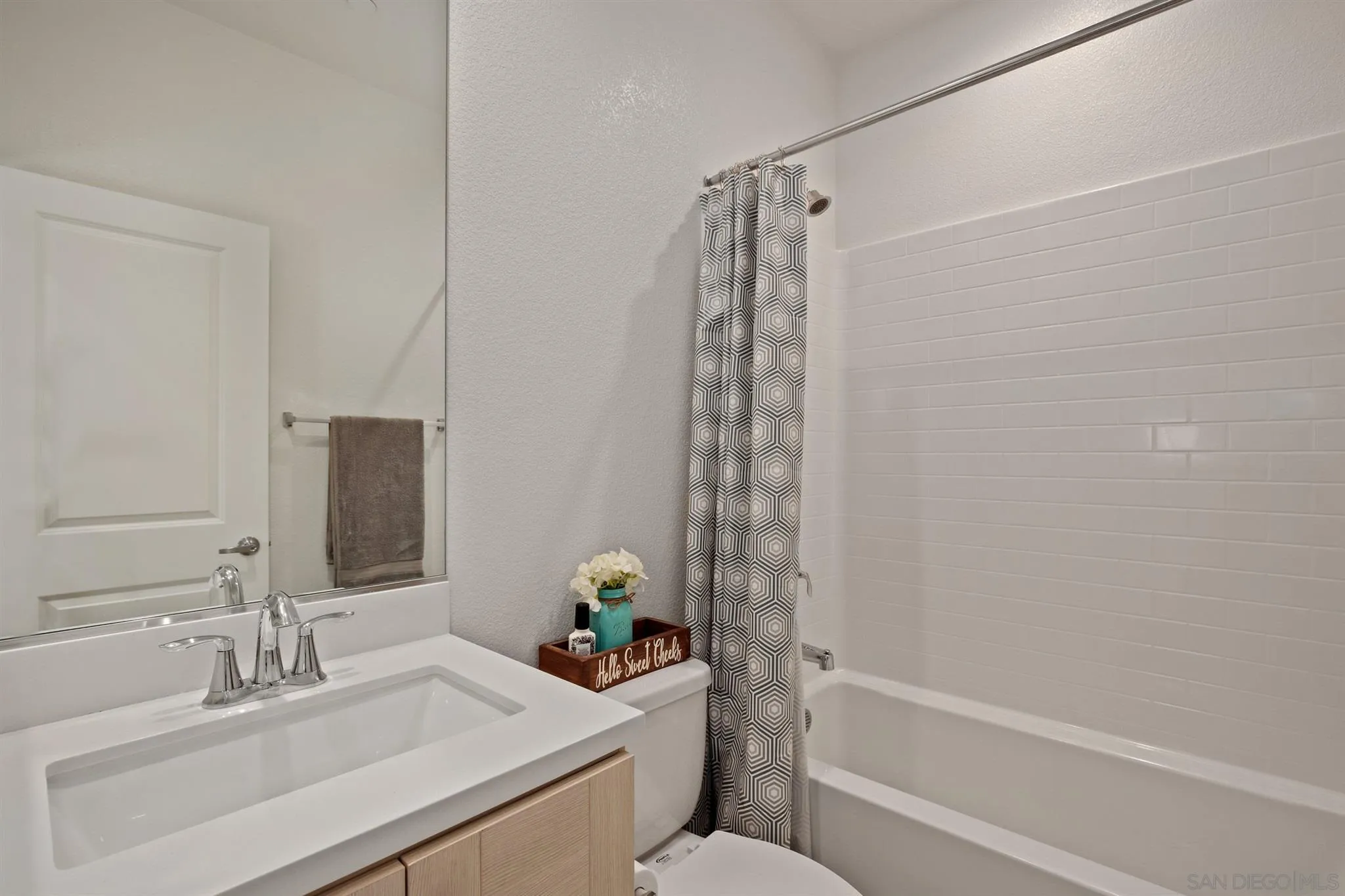 1150 Via Lucero Oceanside, CA 92056 - Photo 7 of 36 a bathroom with a sink toilet and shower