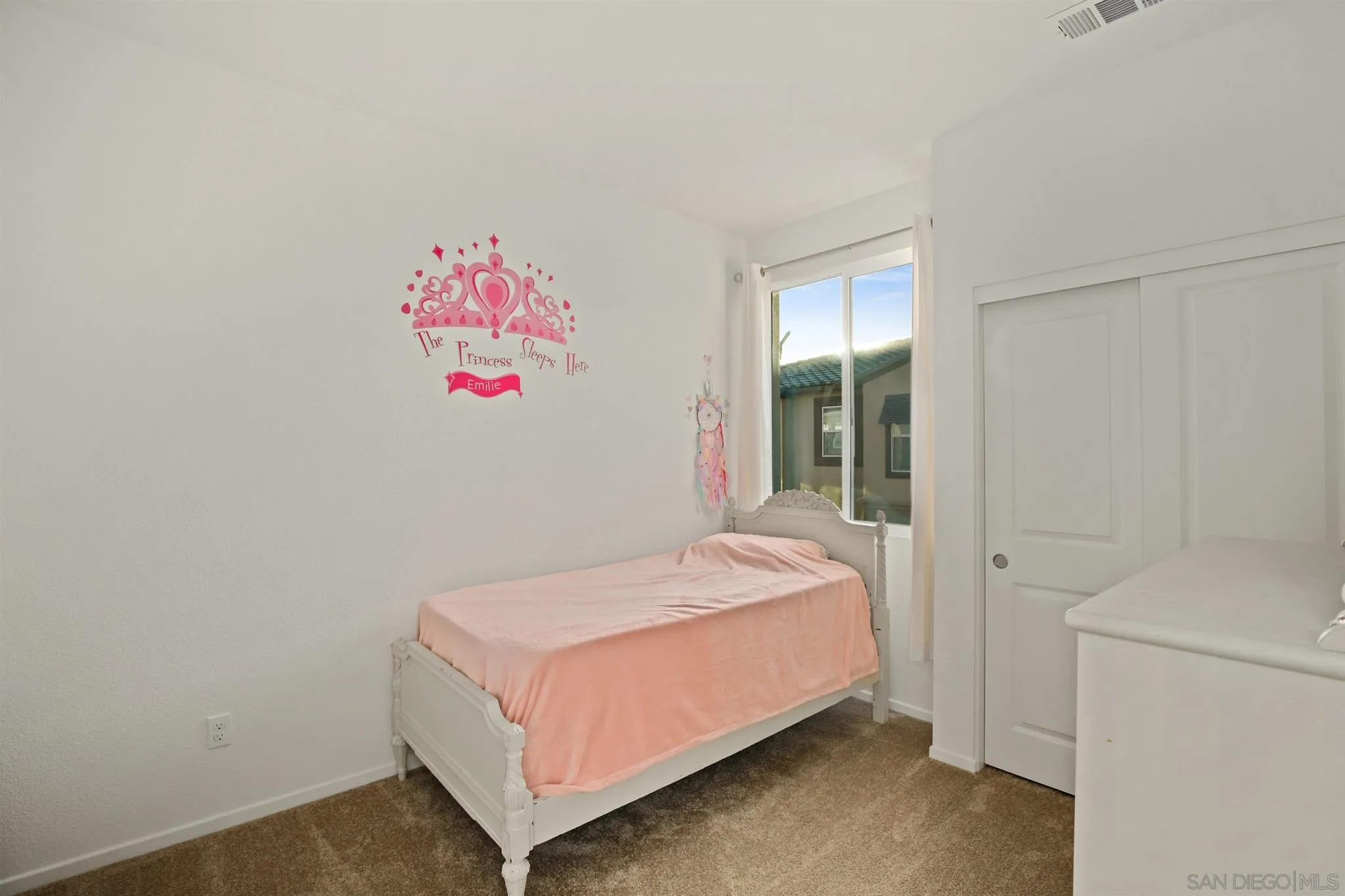 1150 Via Lucero Oceanside, CA 92056 - Photo 8 of 36 a bed sitting in a bedroom next to a window