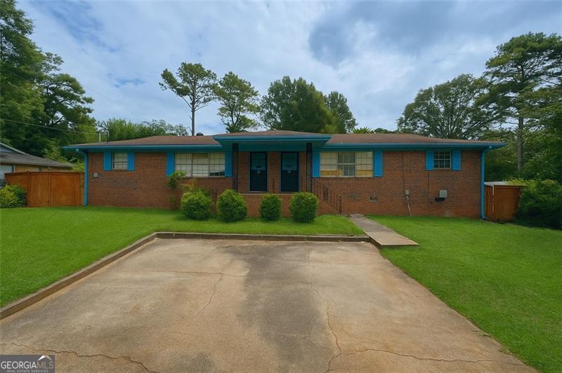 5069-a B Flint Hill, Unit AB Austell, GA 30106 - Photo 1 of 1 a front view of house with yard and green space