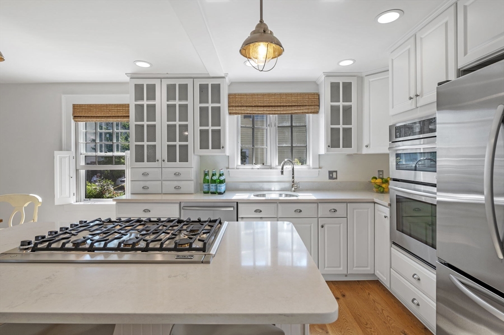 34 Front Street Marblehead, MA 01945 - Photo 17 of 41 a kitchen with stainless steel appliances granite countertop a stove a sink and a refrigerator