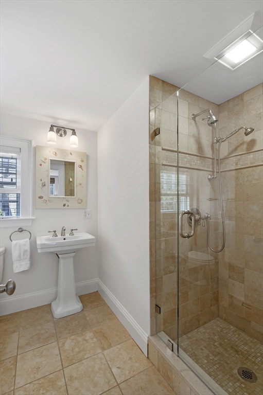 34 Front Street Marblehead, MA 01945 - Photo 20 of 41 a bathroom with a sink a toilet and shower