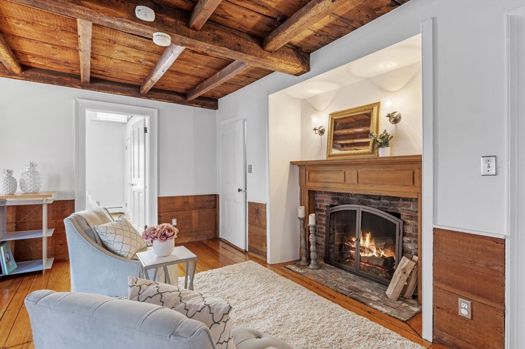 34 Front Street Marblehead, MA 01945 - Photo 25 of 41 a living room with furniture a flat screen tv and a fireplace