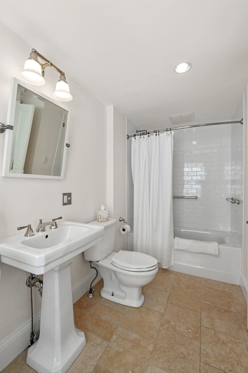 34 Front Street Marblehead, MA 01945 - Photo 32 of 41 a bathroom with a double vanity sink toilet and shower