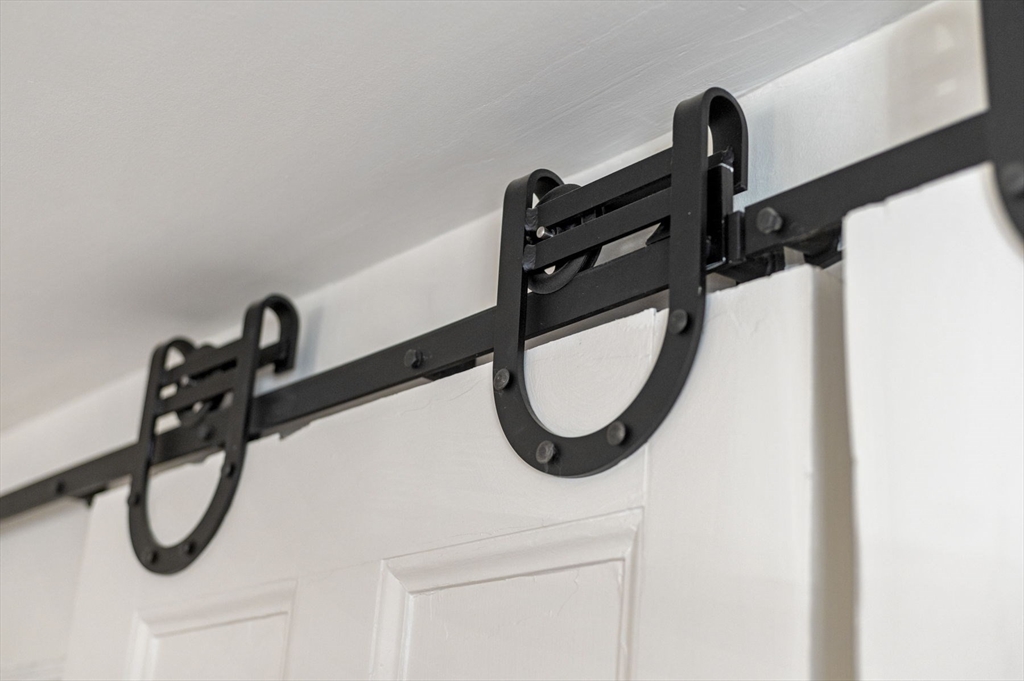 34 Front Street Marblehead, MA 01945 - Photo 10 of 41 a close view of light fixtures and a roof of a building