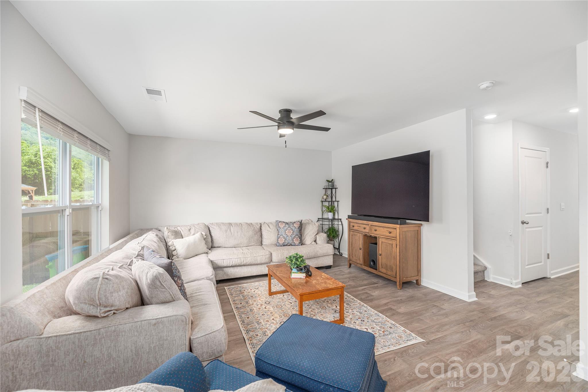 8 Madelyn Drive Clyde, NC 28721 - Photo 10 of 43 a living room with furniture and a flat screen tv