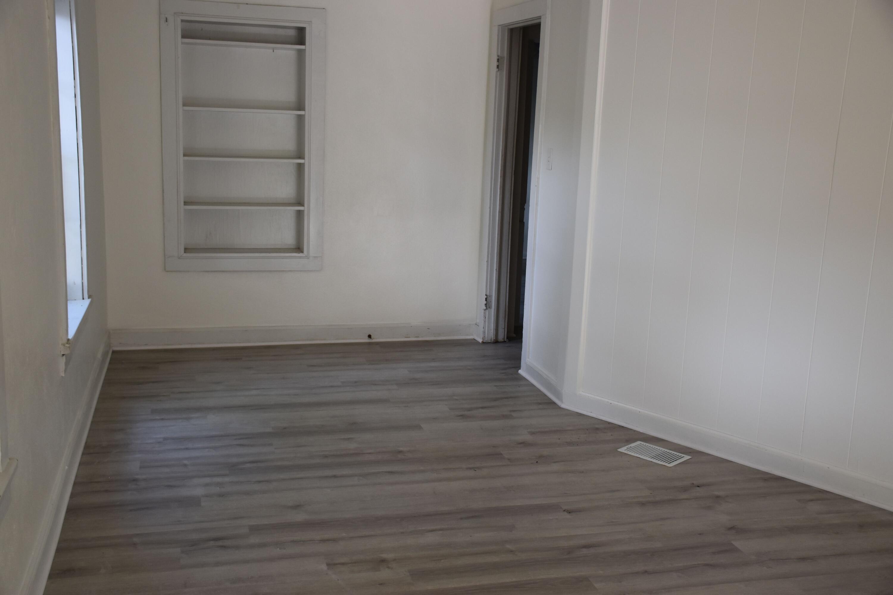 326 Dixie Street Crestview, FL 32536 - Photo 7 of 10 a view of a small space with wooden floor and closet