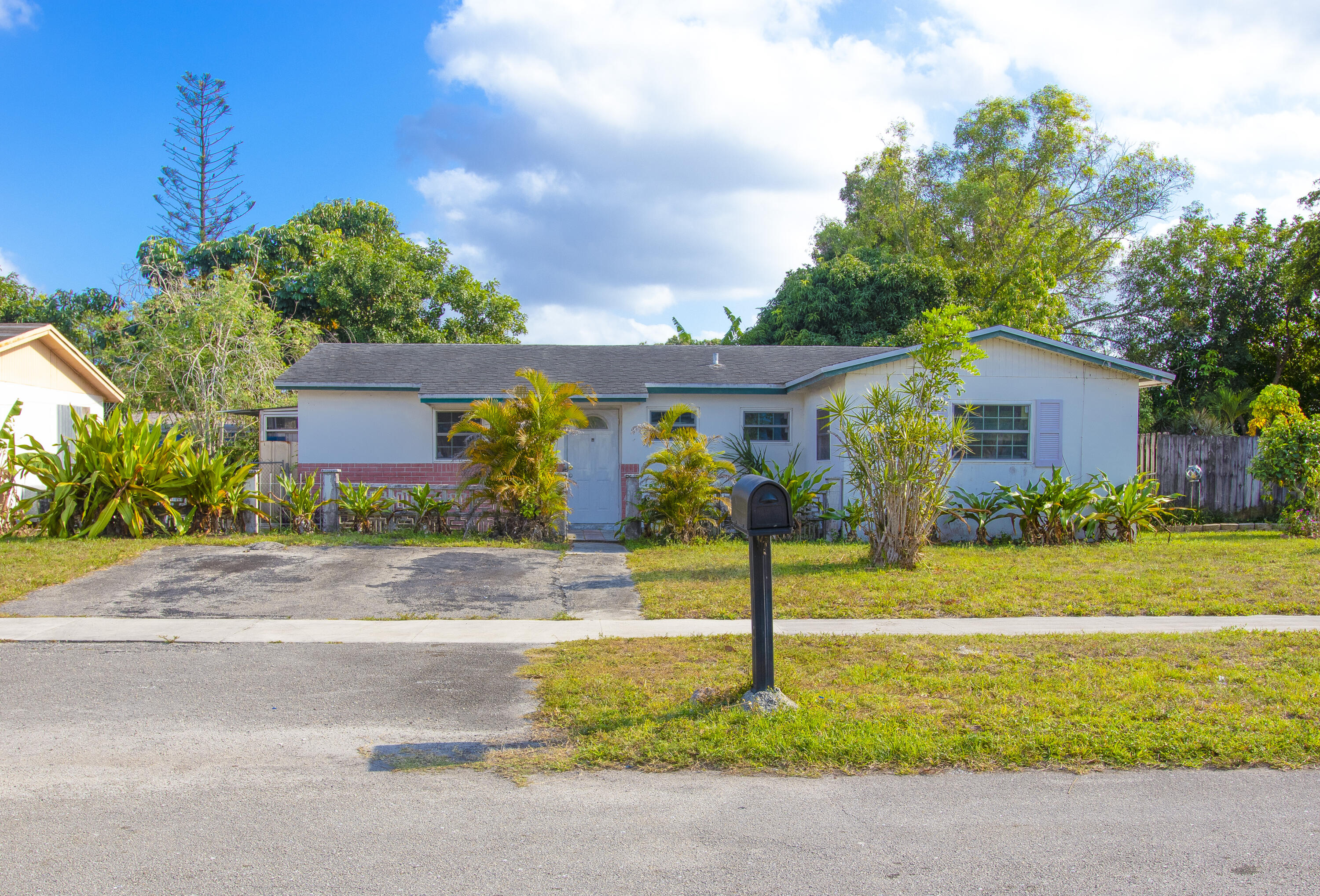 a view of a house with garden and plants