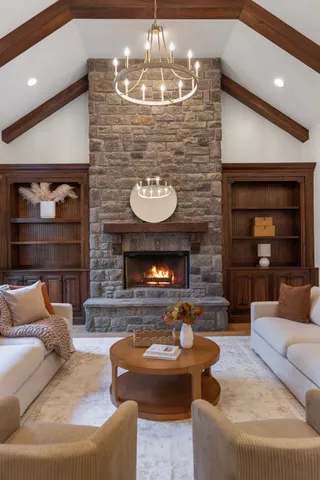 a kitchen with granite countertop white cabinets and stainless steel appliances