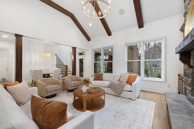 a kitchen with stainless steel appliances granite countertop a sink and white cabinets