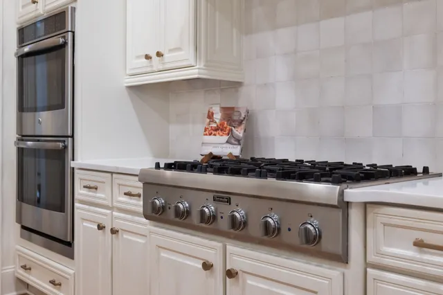 a view of a livingroom with furniture and a floor to ceiling window