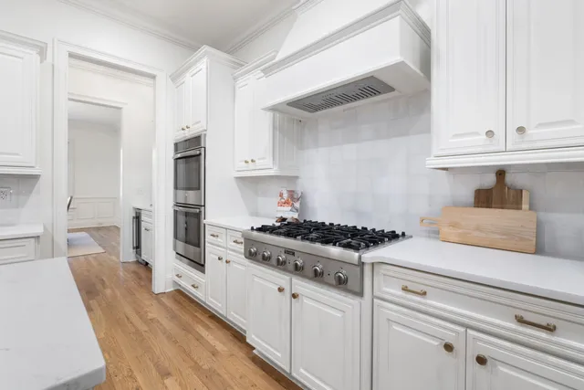 a view of a backyard with large trees
