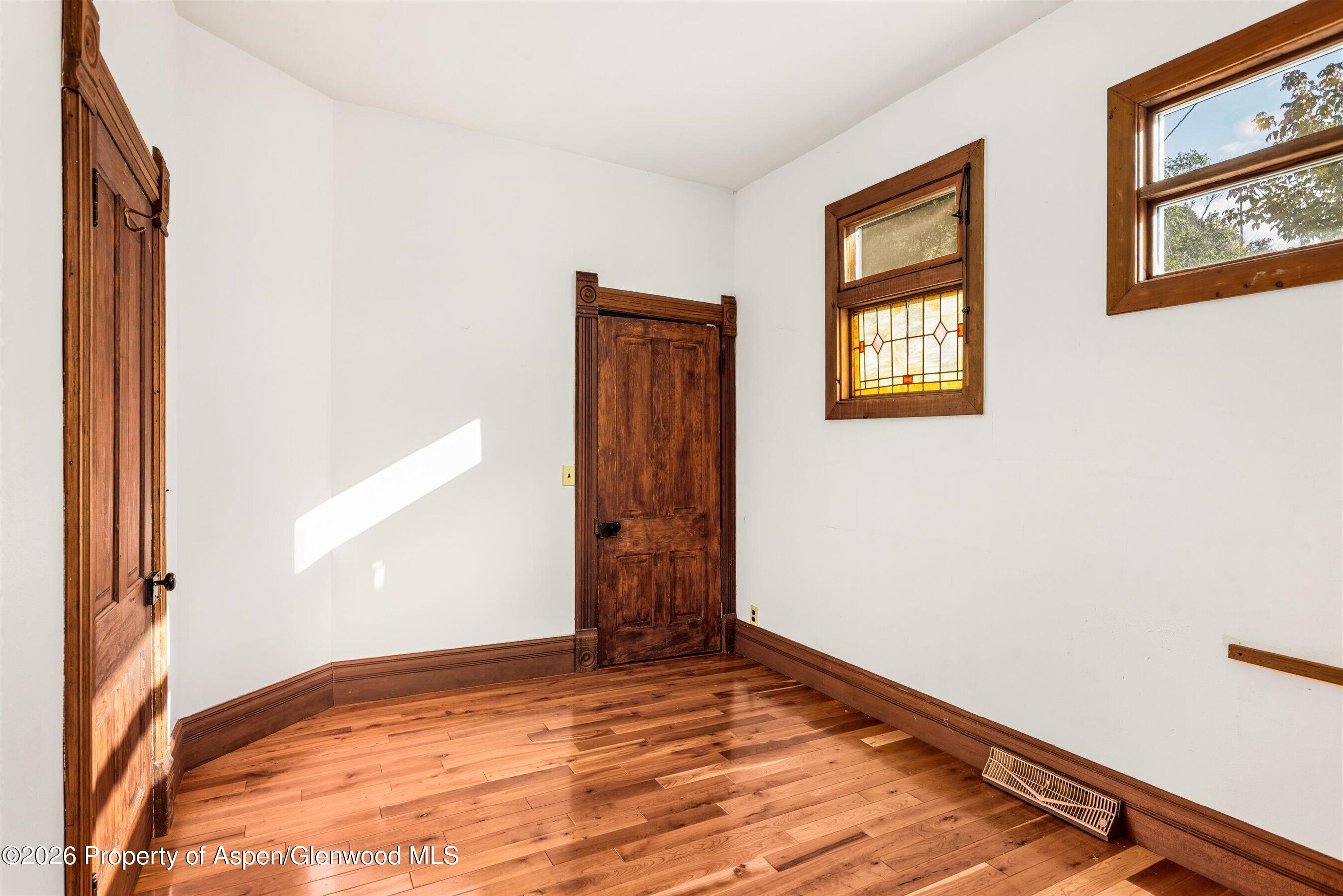 235 East Homestead Drive Basalt, CO 81621 - Photo 18 of 38 a view of empty room with window and wooden floor