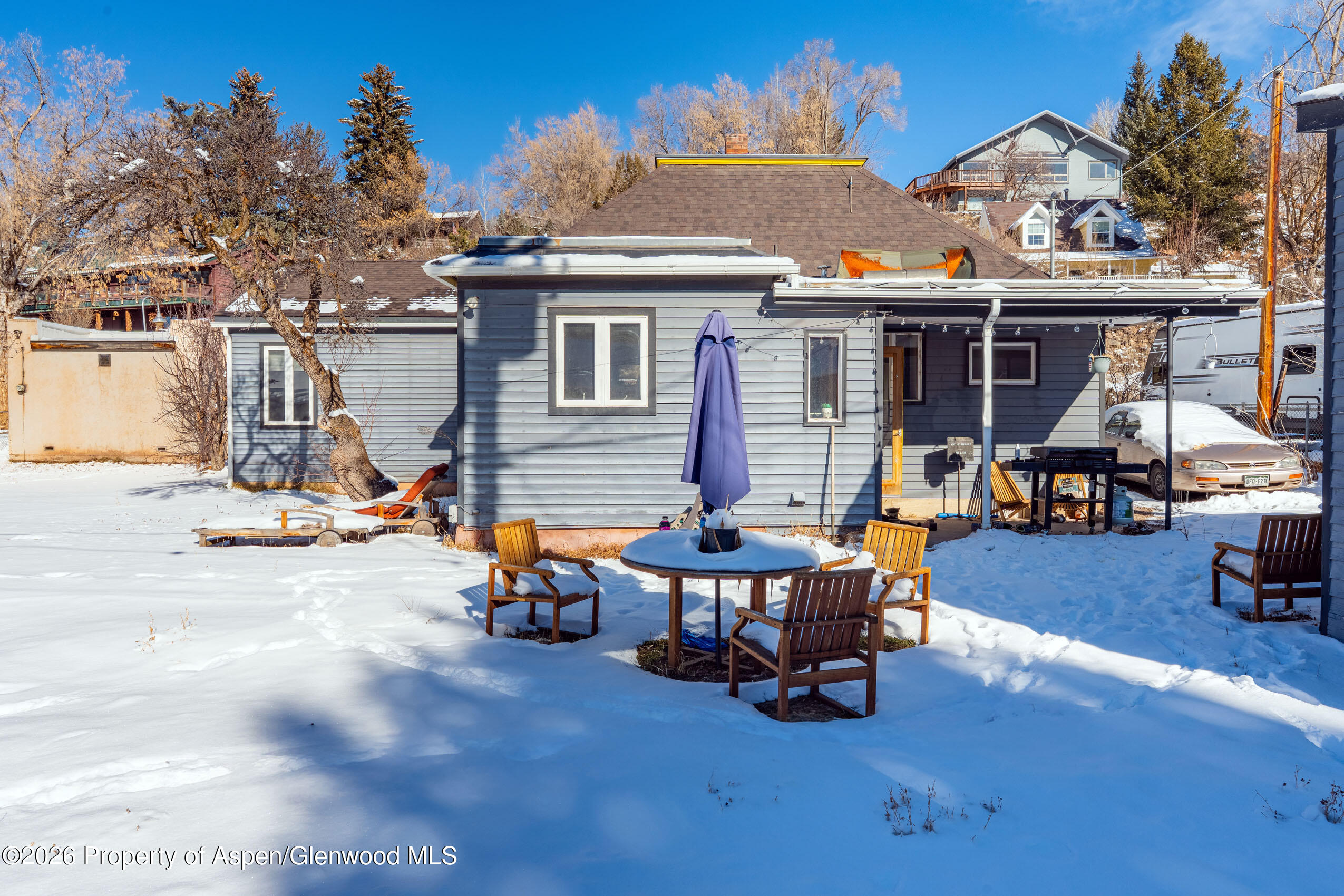 235 East Homestead Drive Basalt, CO 81621 - Photo 26 of 38 a view of a patio with a table and chairs