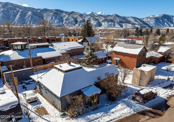 a picture of a outdoor space with lounge chairs