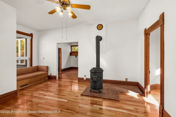a view of a livingroom with furniture wooden floor a chandelier