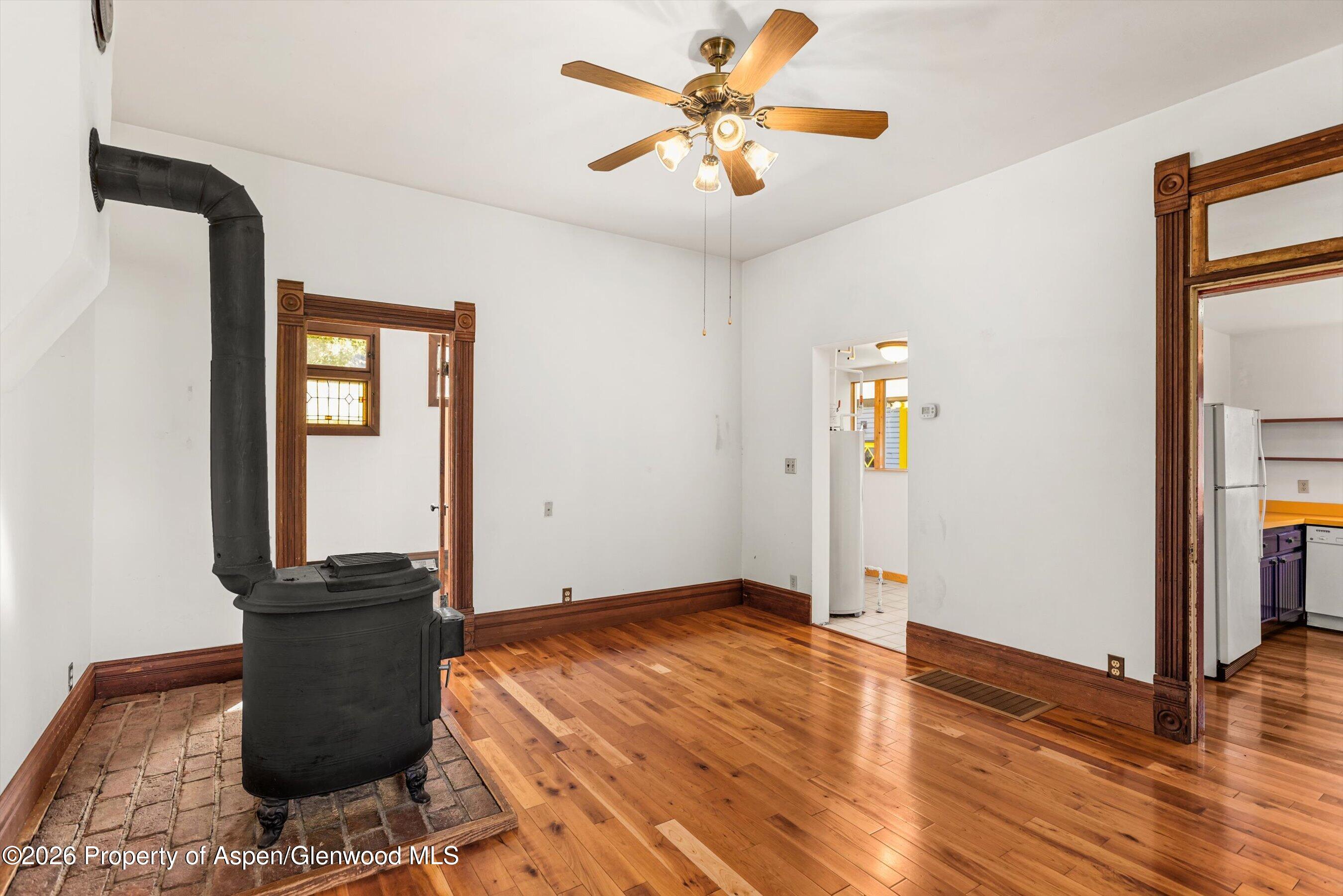 235 East Homestead Drive Basalt, CO 81621 - Photo 9 of 38 a view of a livingroom with wooden floor and a ceiling fan