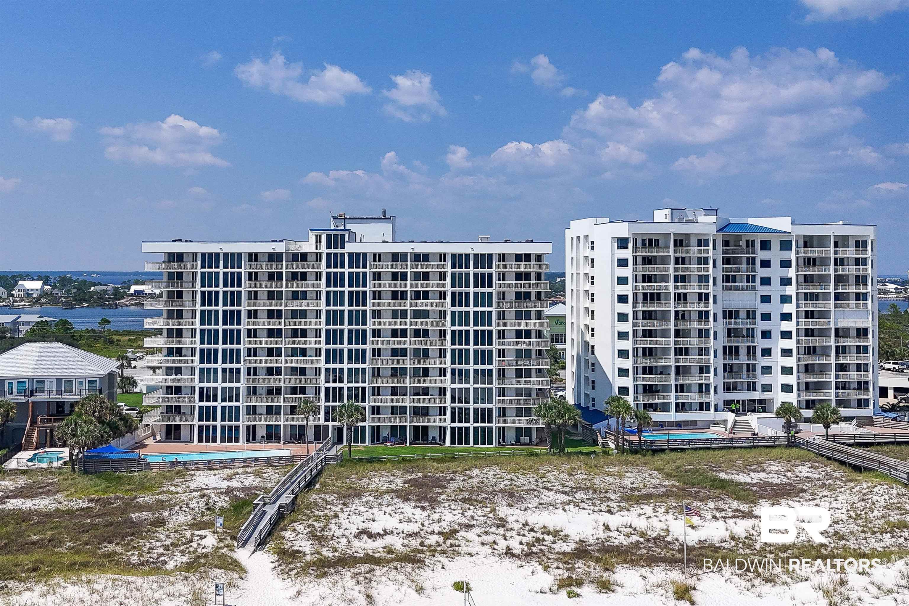 16287 Perdido Key Drive, Unit 105 Pensacola, FL 32507 - Photo 5 of 66 Twin high-rise residential buildings with multiple balconies