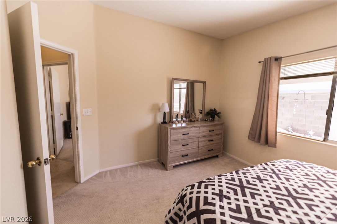 4994 Mascaro Drive Las Vegas, NV 89122 - Photo 9 of 30 Plush carpeting underfoot defines this comfortable bedroom space.
