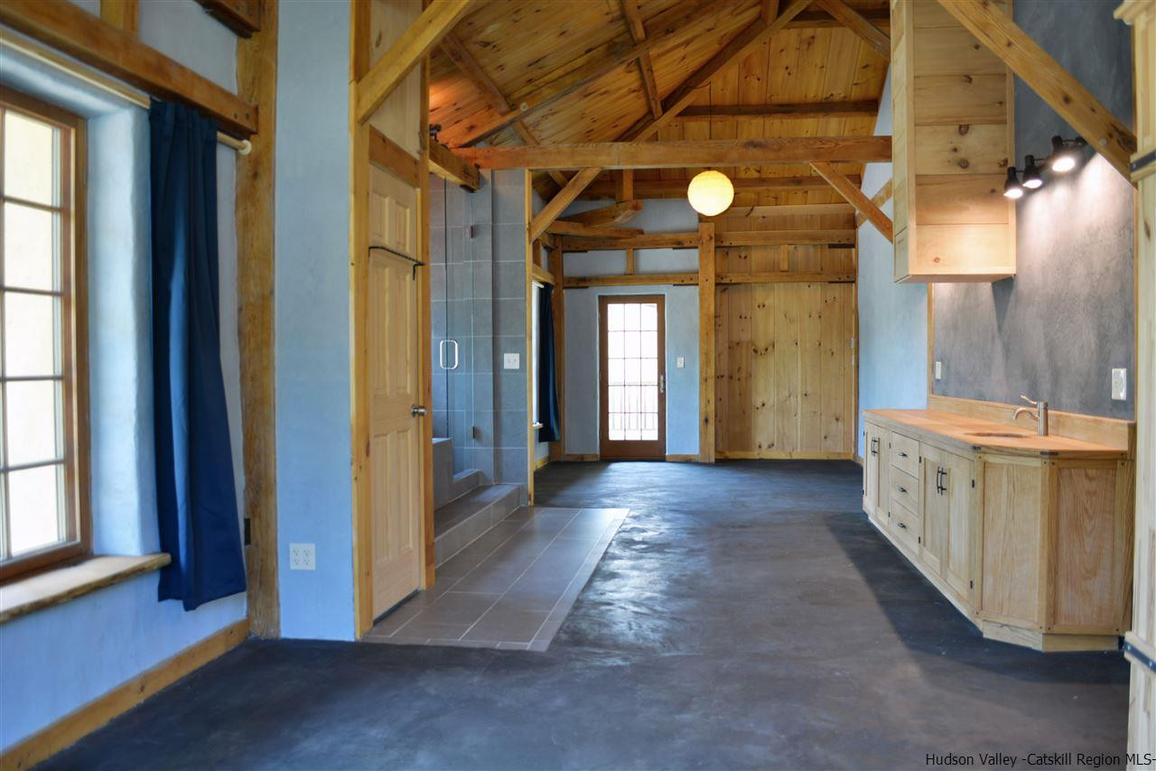 328 Stony Kill Road Accord, NY 12404 - Photo 20 of 35 a view of a hallway with wooden floor and a bathroom