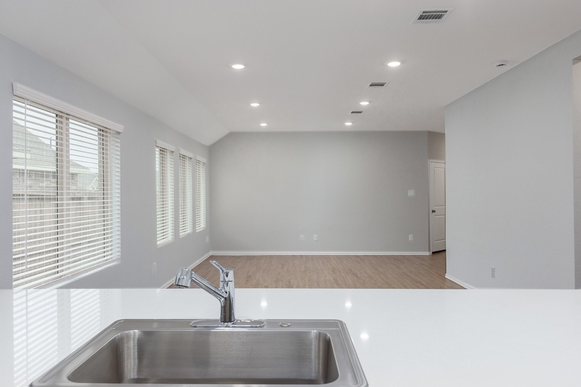 6327 Arcadia Sound Lane Houston, TX 77365 - Photo 11 of 33 a kitchen with a sink and large window