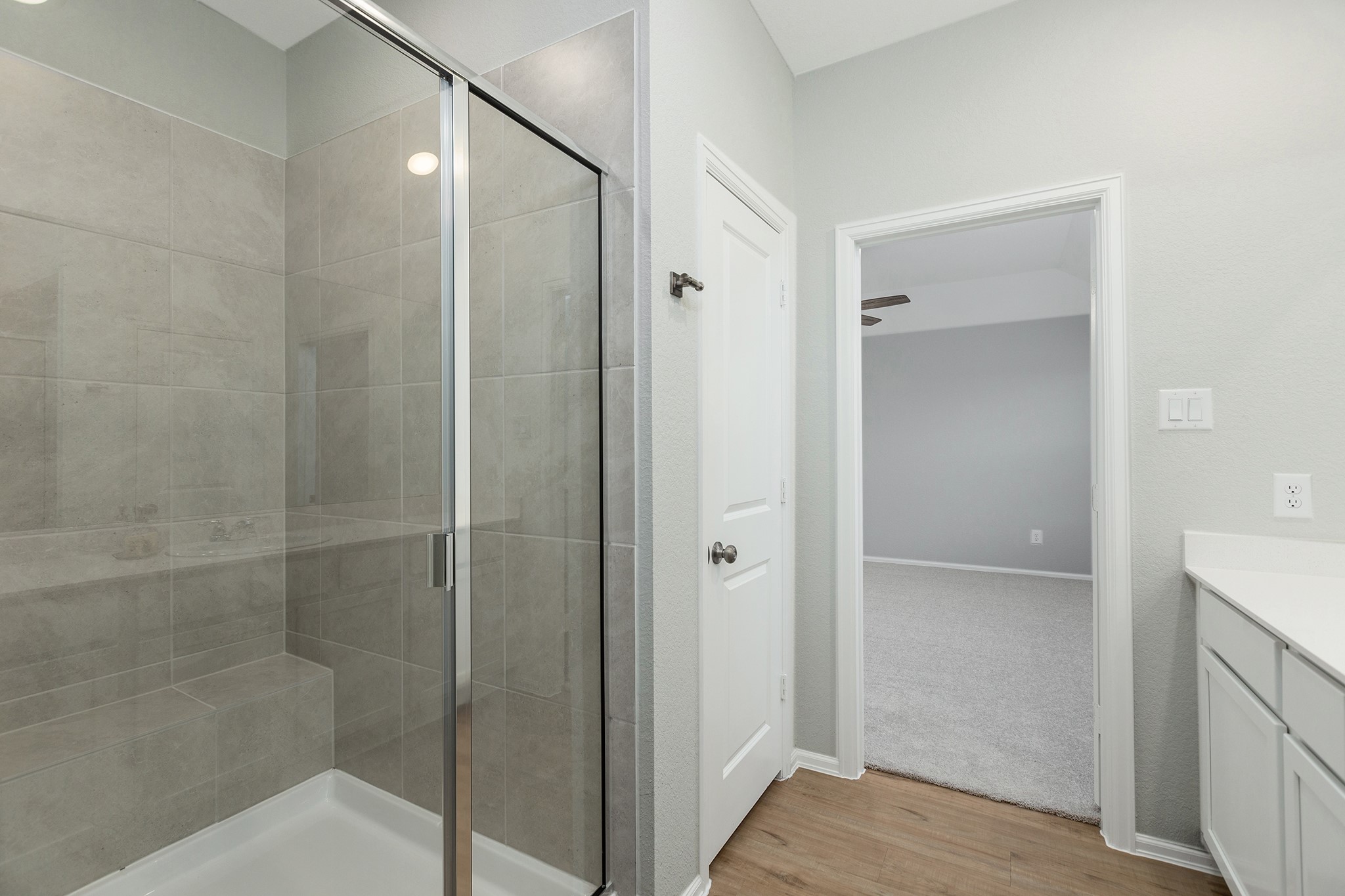 6327 Arcadia Sound Lane Houston, TX 77365 - Photo 17 of 33 a bathroom with a shower and a glass door
