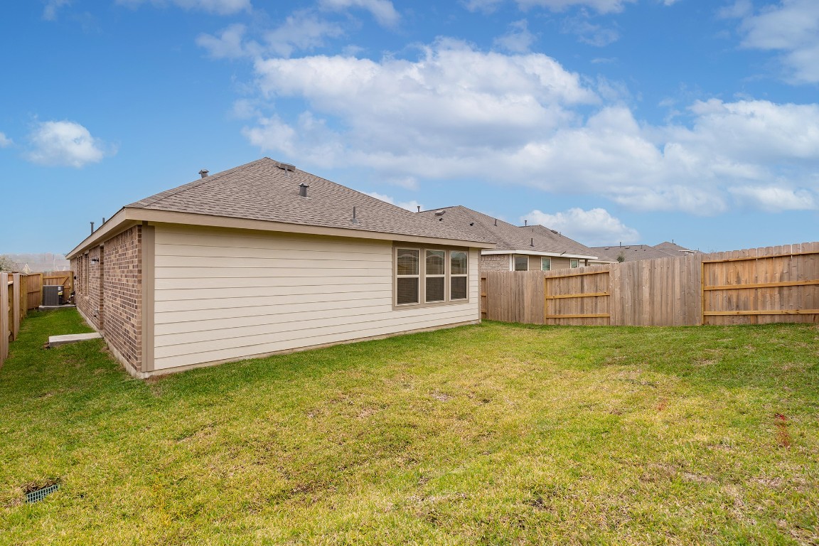 6327 Arcadia Sound Lane Houston, TX 77365 - Photo 24 of 33 a view of a house with a backyard