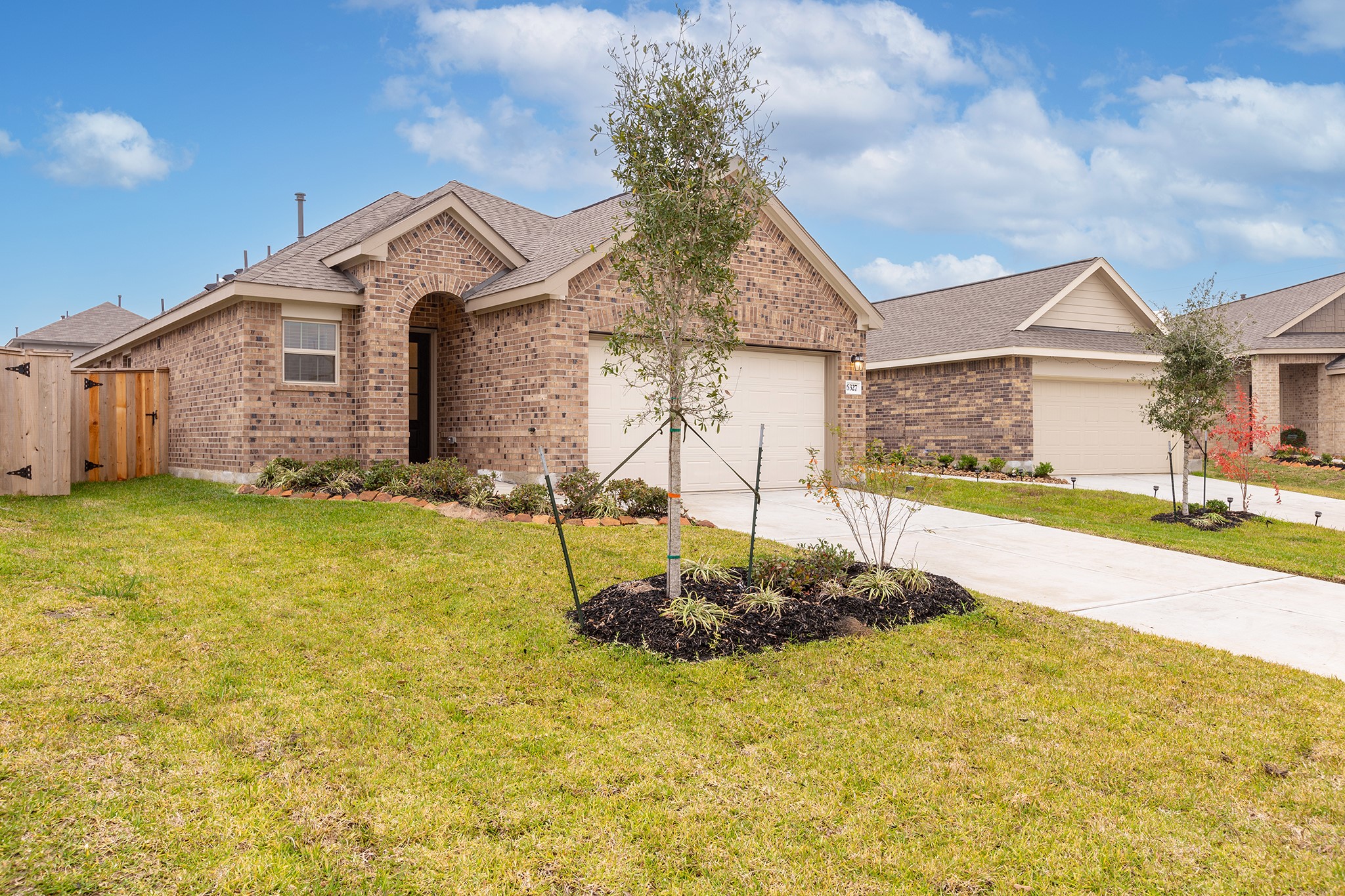 6327 Arcadia Sound Lane Houston, TX 77365 - Photo 3 of 33 a front view of a house with a yard
