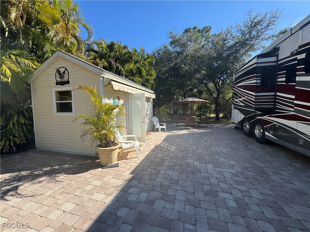 Lot 212-3027 Belle Of Myers Road LaBelle, FL 33935 - Photo 13 of 43 a view of a house with a patio