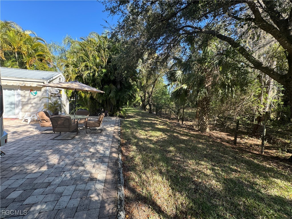 Lot 212-3027 Belle Of Myers Road LaBelle, FL 33935 - Photo 18 of 43 a view of outdoor space with trees