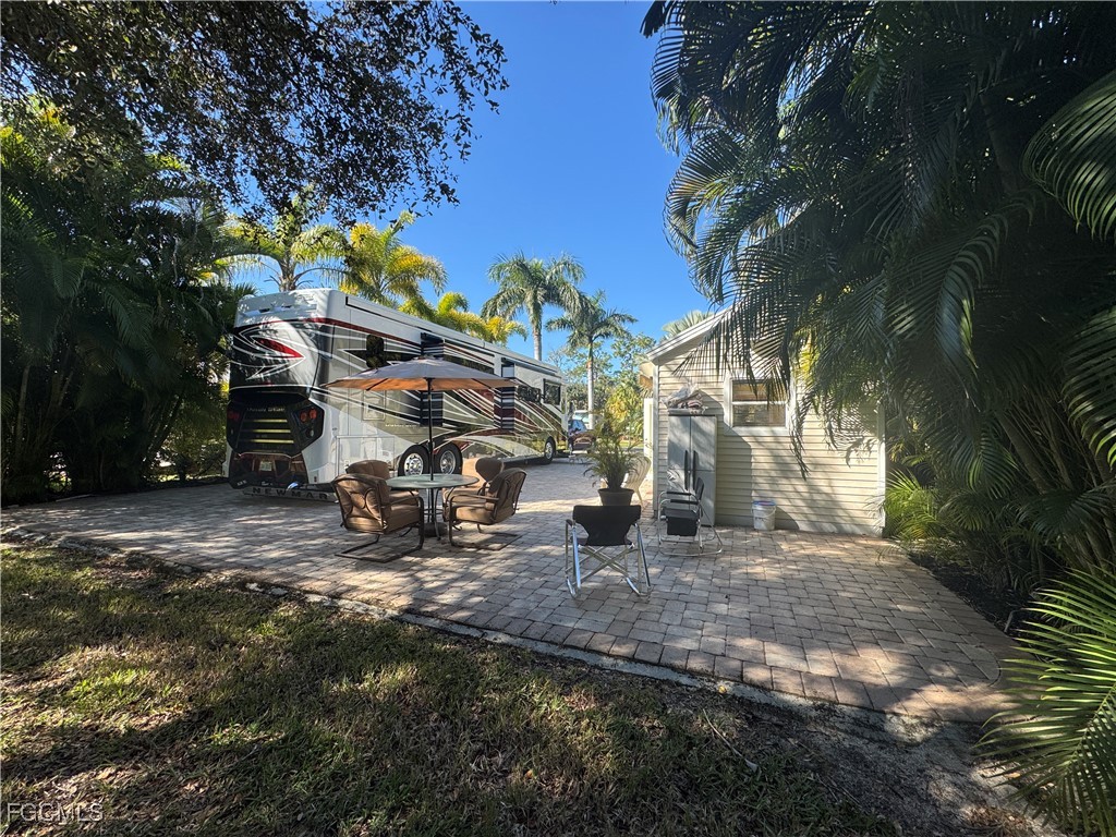 Lot 212-3027 Belle Of Myers Road LaBelle, FL 33935 - Photo 21 of 43 a view of a park with swings and slides