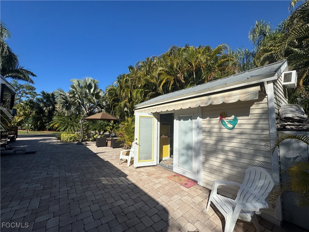 Lot 212-3027 Belle Of Myers Road LaBelle, FL 33935 - Photo 24 of 43 a view of a door and chair in the patio