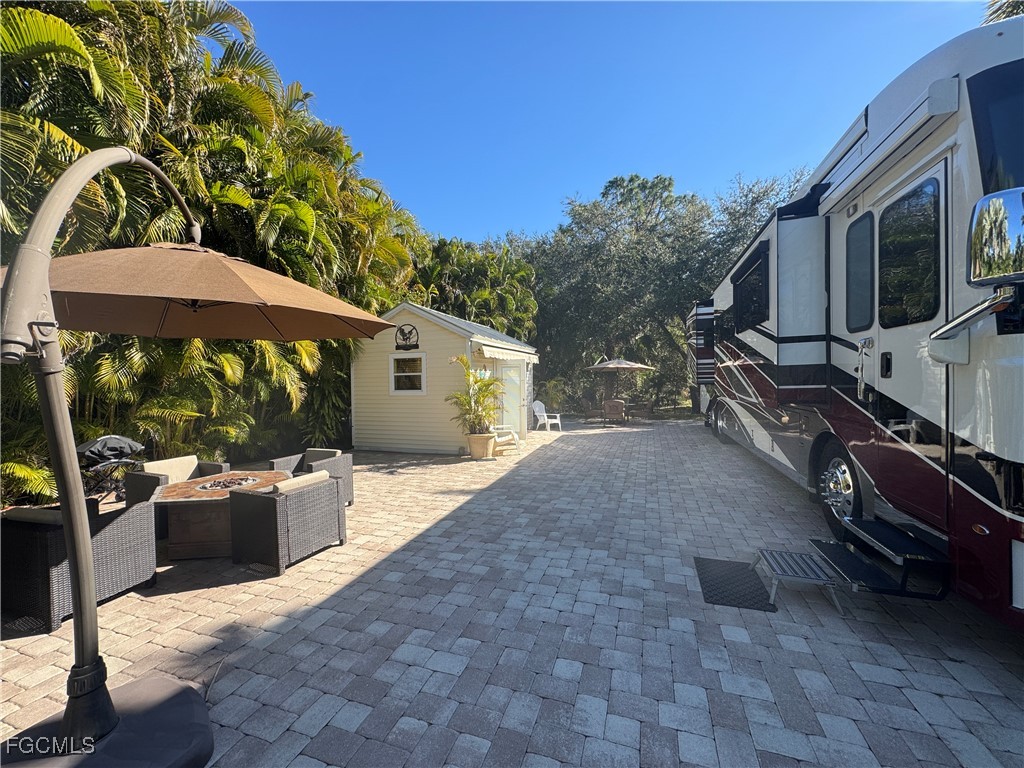 Lot 212-3027 Belle Of Myers Road LaBelle, FL 33935 - Photo 3 of 43 a view of a house with backyard and furniture