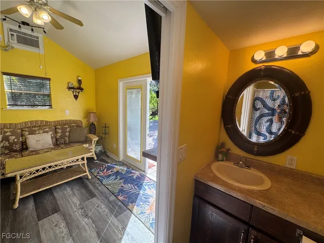 a bathroom with a sink a mirror and a toilet