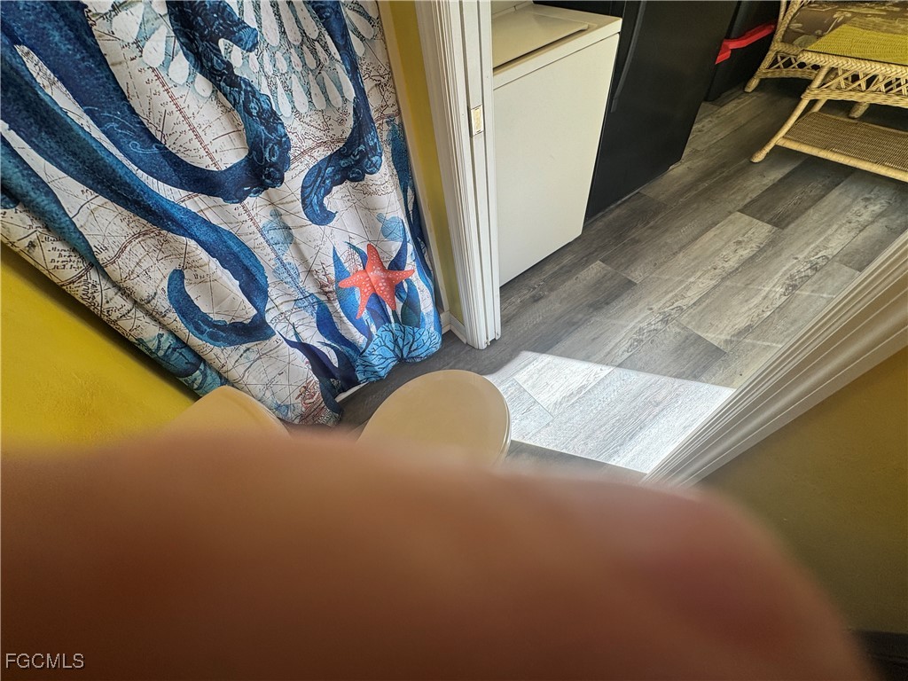 Lot 212-3027 Belle Of Myers Road LaBelle, FL 33935 - Photo 36 of 43 a view of a room with wooden floor and a rug