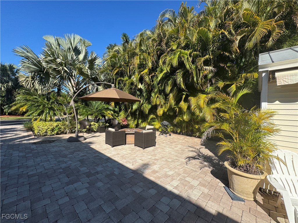 Lot 212-3027 Belle Of Myers Road LaBelle, FL 33935 - Photo 38 of 43 a wooden bench sitting in front of a building