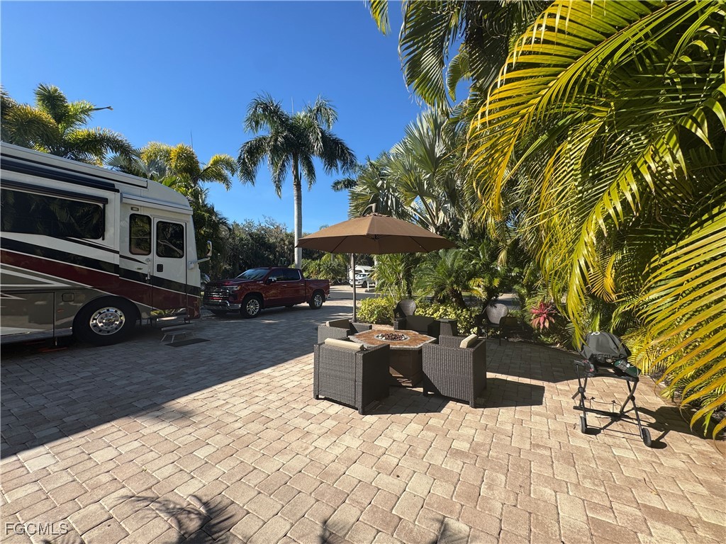 Lot 212-3027 Belle Of Myers Road LaBelle, FL 33935 - Photo 39 of 43 a view of a backyard with sitting area