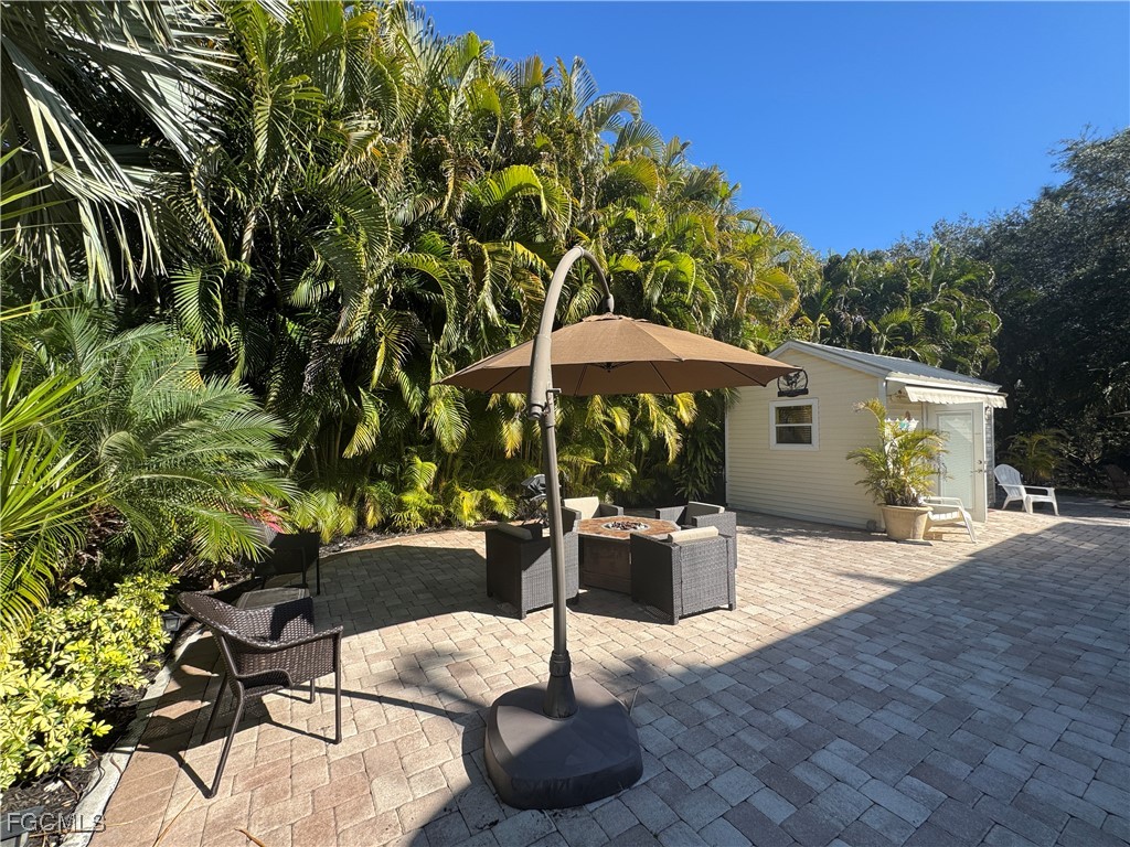 Lot 212-3027 Belle Of Myers Road LaBelle, FL 33935 - Photo 9 of 43 a swimming pool with outdoor seating and yard